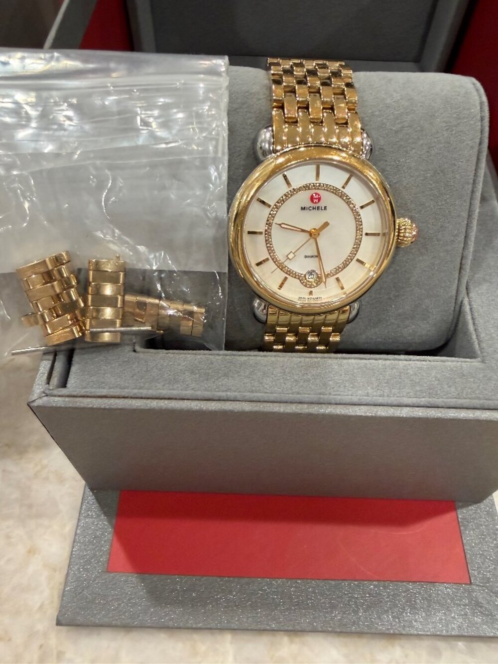 MICHELE, SWISS MOVEMENT, GOLDTONE, DATE AND DIAMOND LADIES WATCH